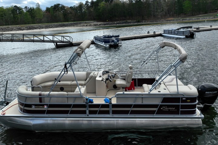 a boat is docked next to a body of water